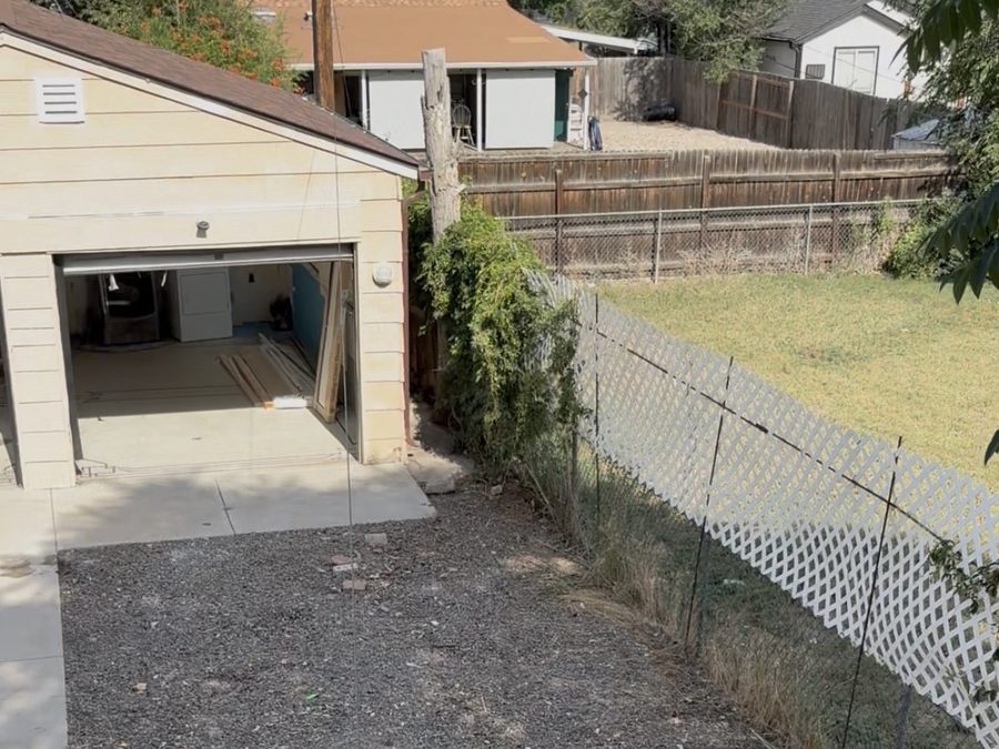 The same backyard after the shed was demolished and the debris hauled away