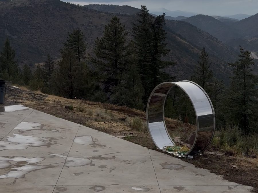 Cleared concrete pad on a mountain-community property with mountain views
